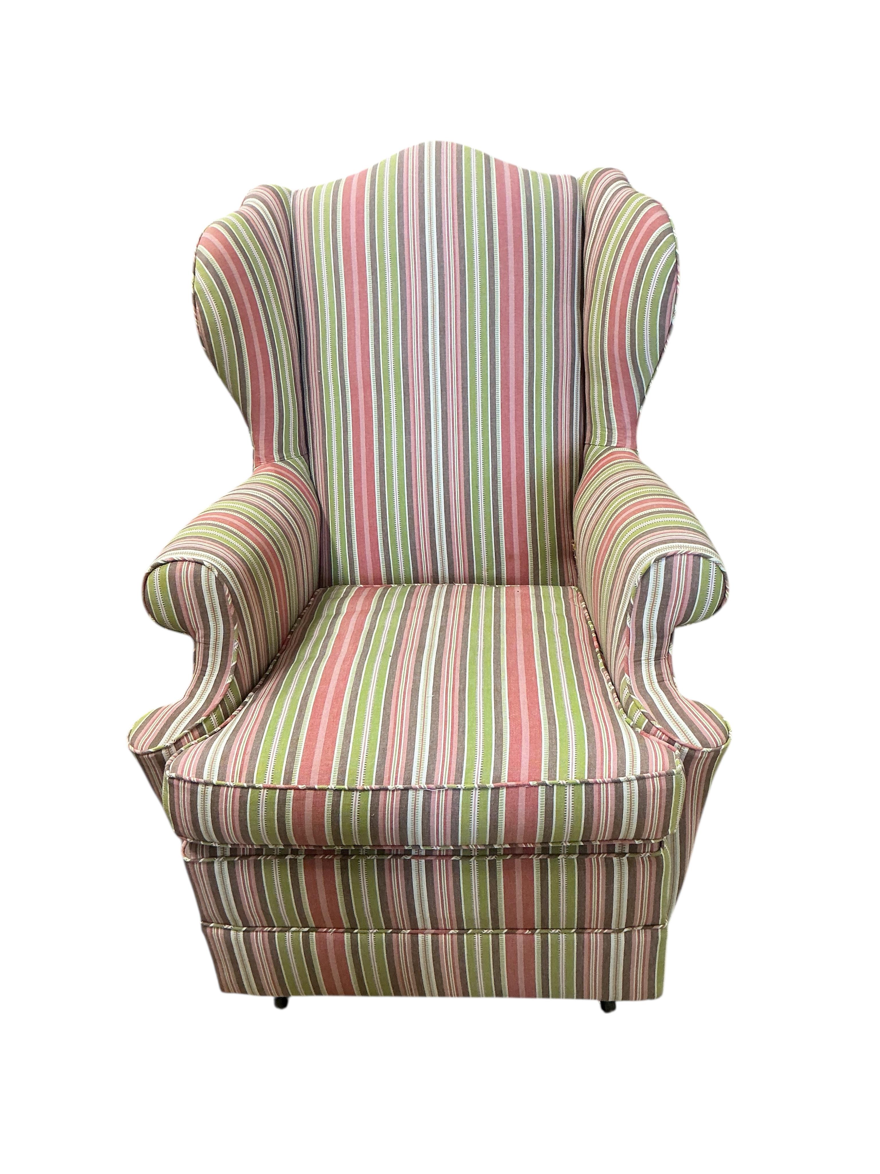 A Victorian style upholstered wing armchair, width 70cm, depth 80cm, height 94cm